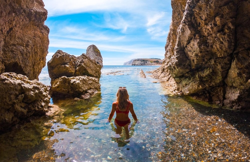 Person swimming in a cave 