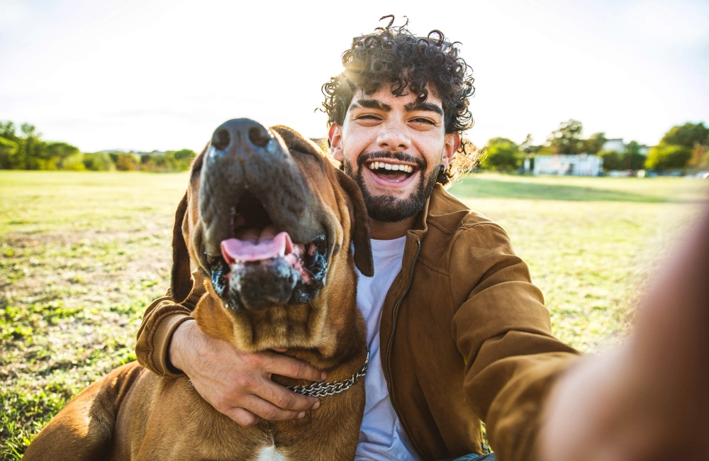 Man taking a selfie with his dog