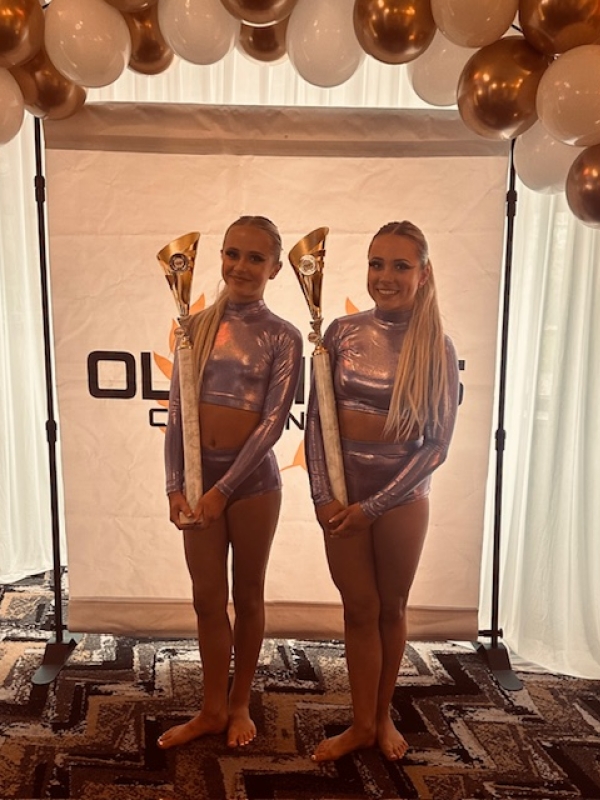 Isabel and Jasmine holding trophies