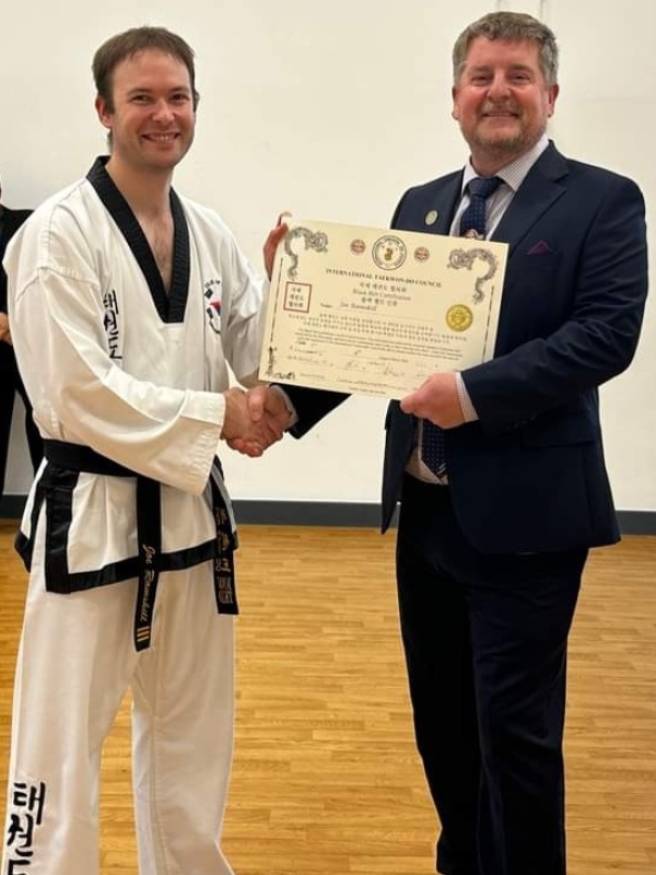 Joe receiving his black belt