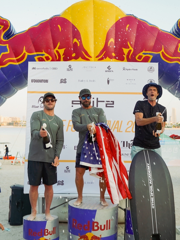 Tom Court on a podium in dubai