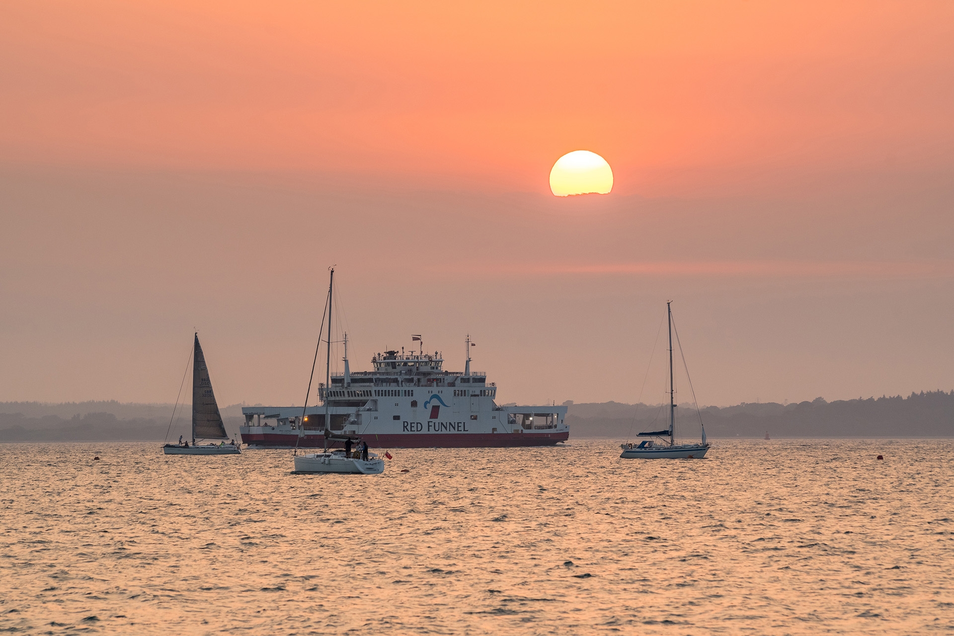 Image of the ferry on the water at dusk