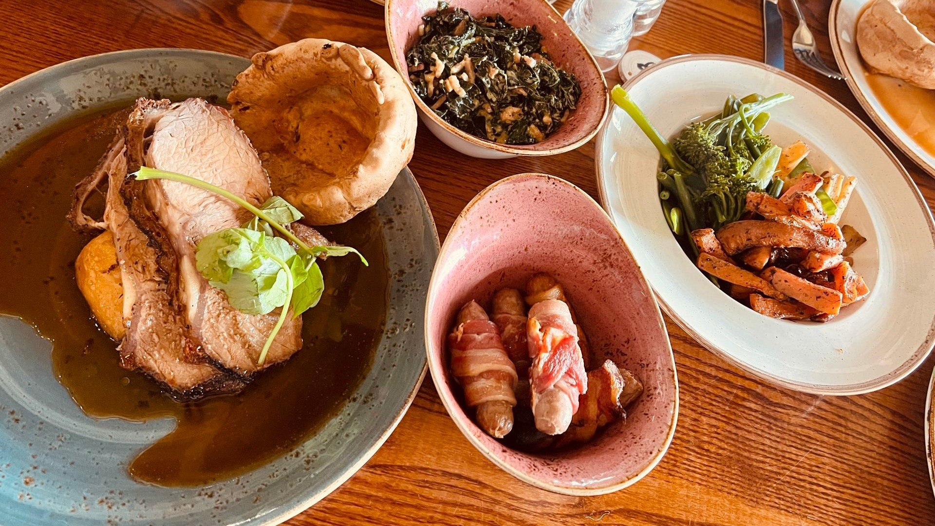 chicken roast dinner with pigs in blankets and vegetables