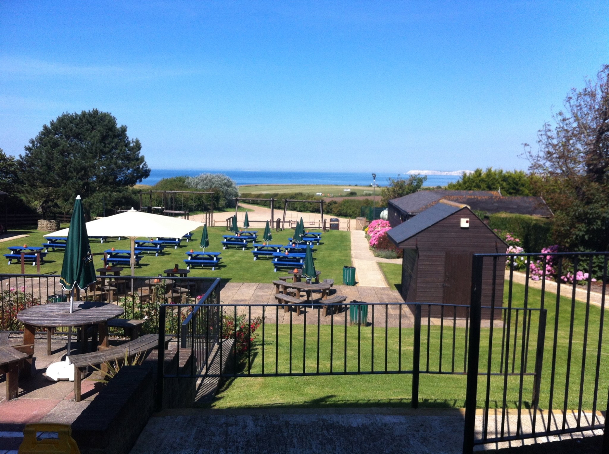 Far reaching beer garden with children's play equipment in background