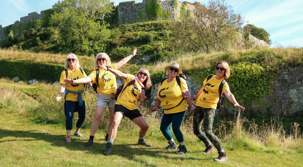 group of walkers posing looking happy