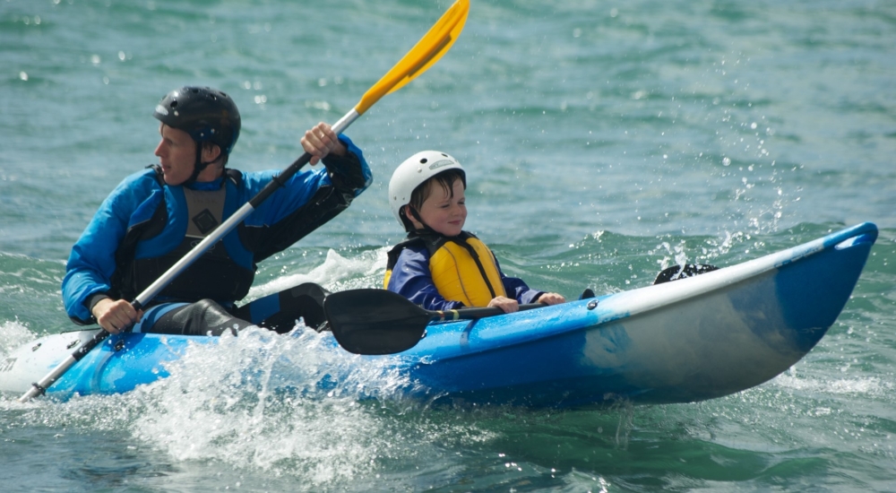 dad and son kayaking