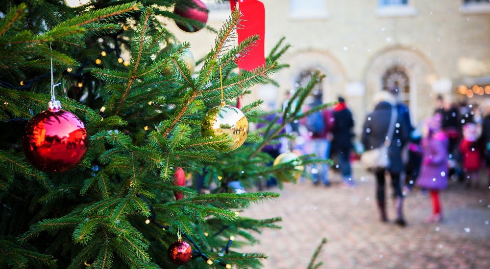 christmas tree with red baubles and ribbons