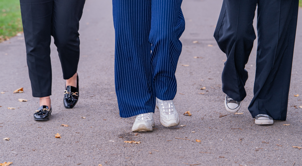 three sets of legs walking