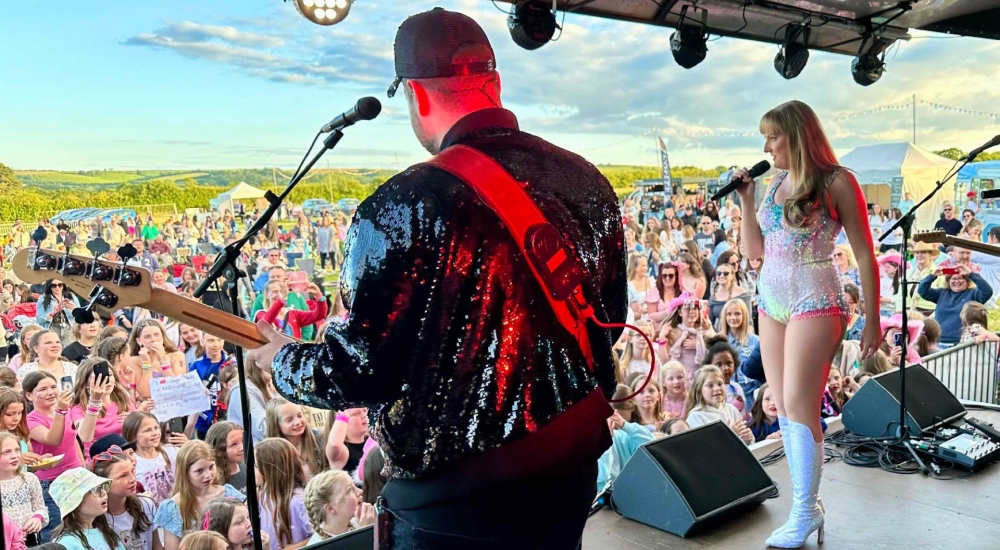 a shot from the stage of taylor swift tribute and crowd